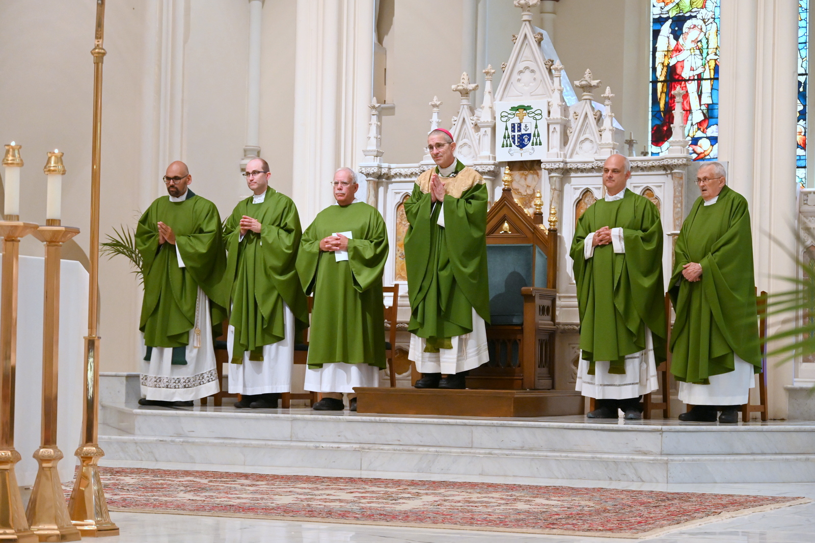 Bishop James Ruggieri and priests at Mass at the cathedral.