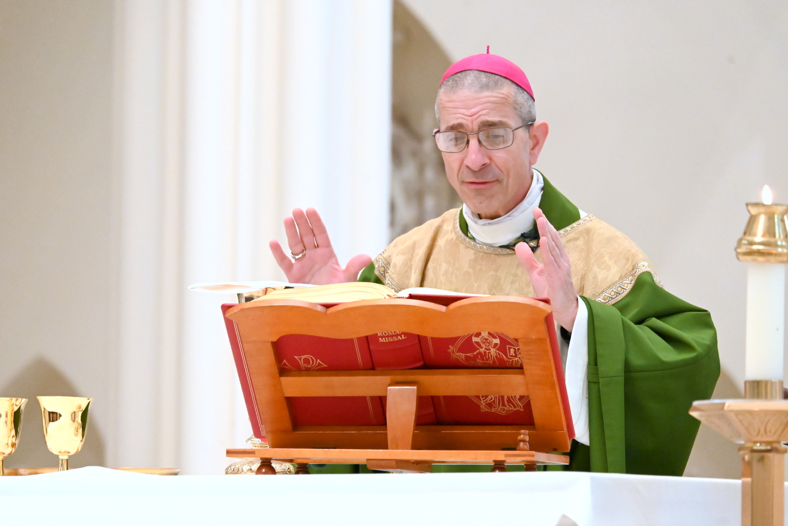 Bishop James Ruggieri praying.