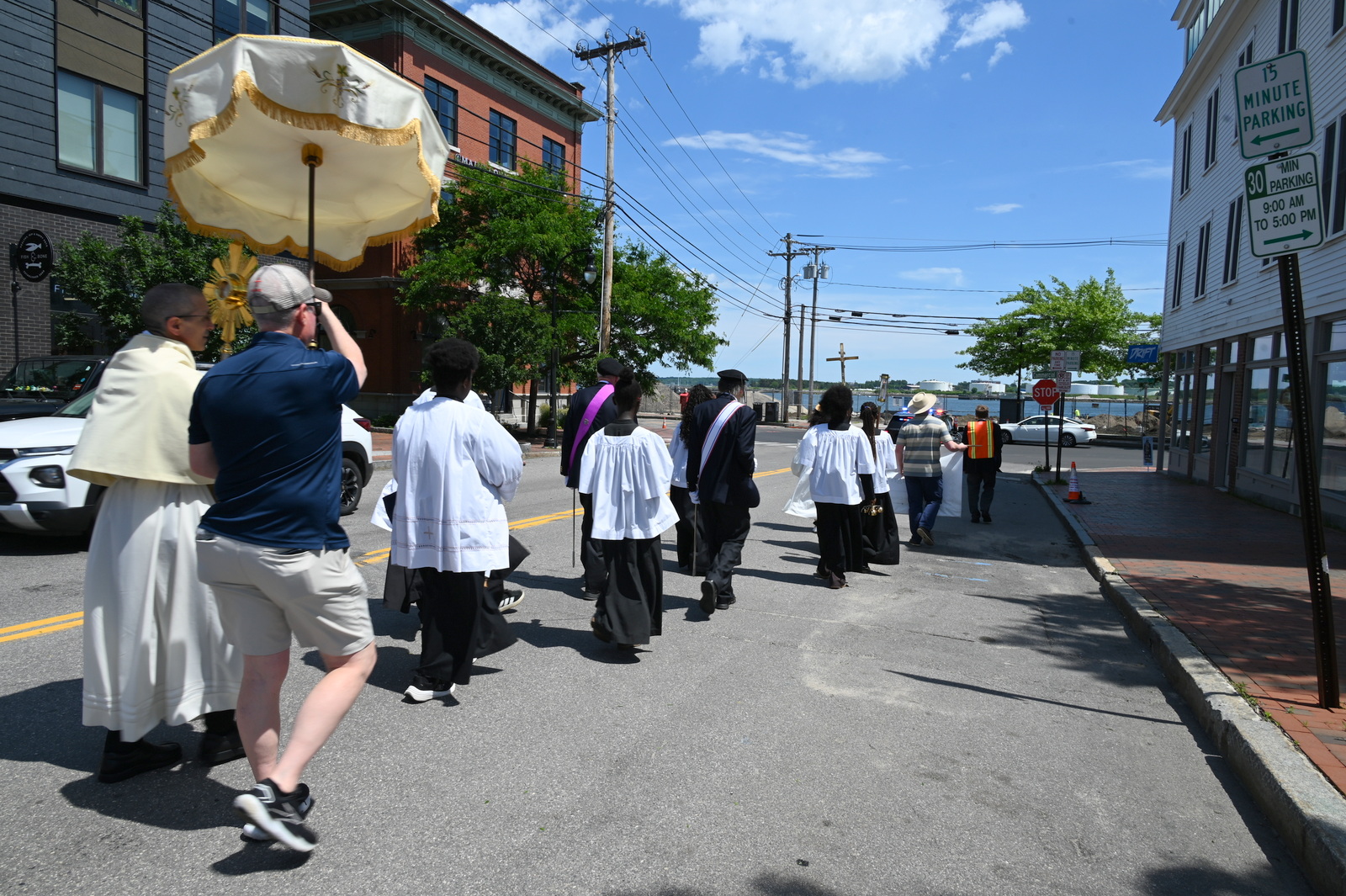 Procession walking towards water