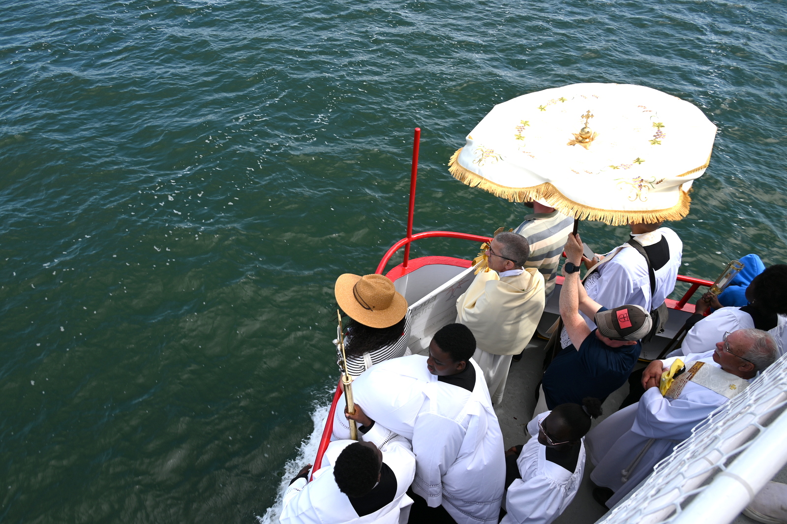 Bishop Ruggieri and parishioners on ferry boat