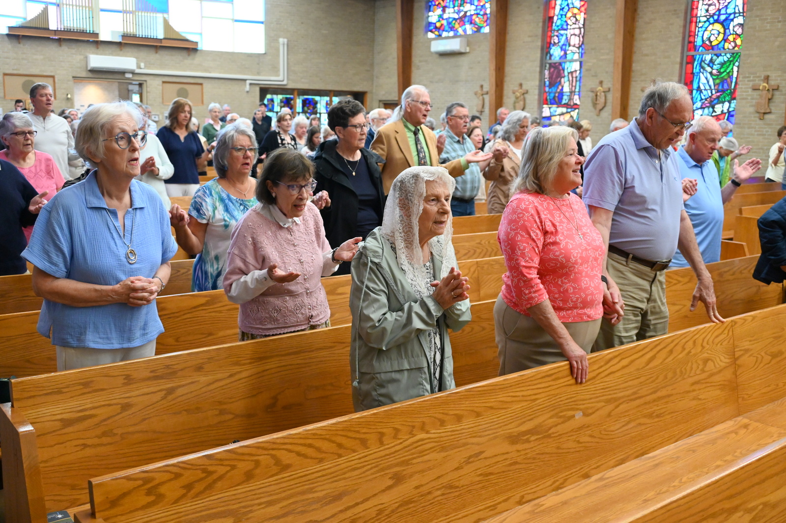 People in the pews at St. Christopher Church in York.