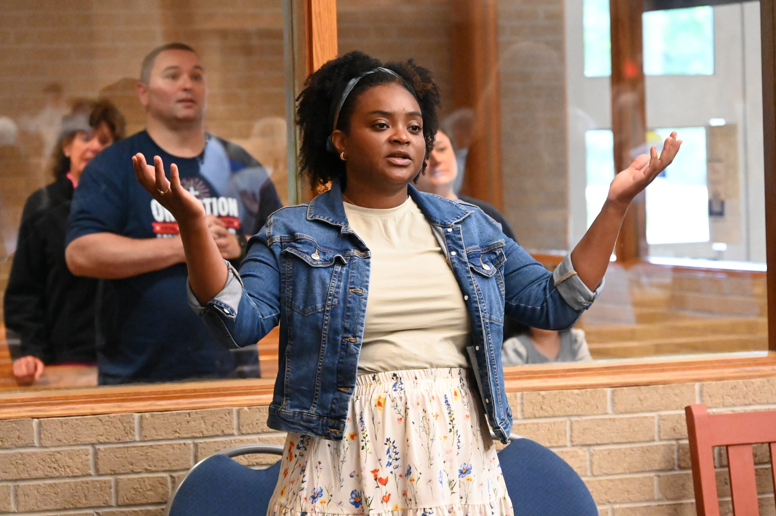 Woman lifting up her arms in prayer.