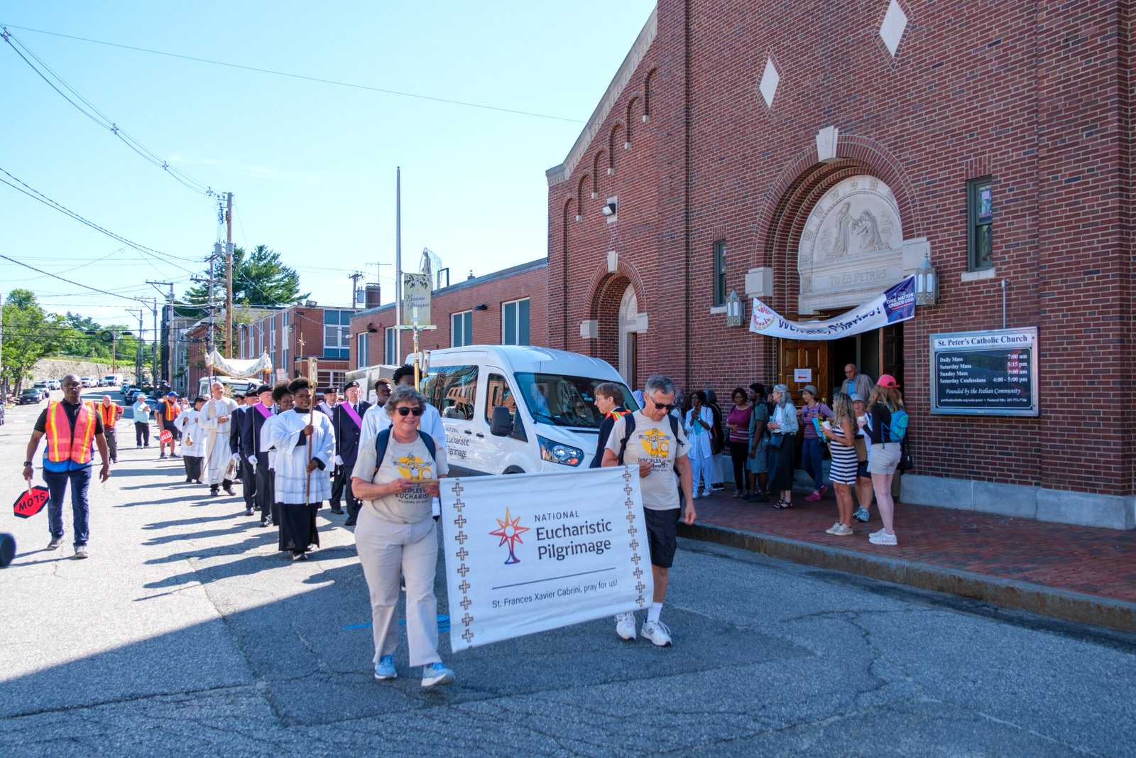 Procession leaves St. Peter Church for Sacred Heart Church in Portland.