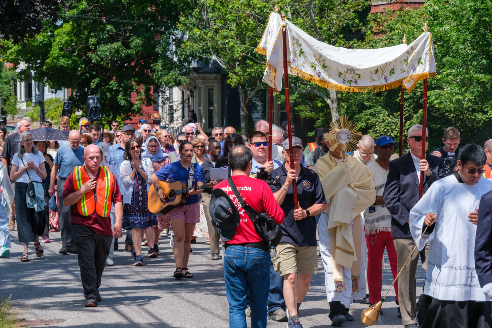 Procession heads towards the Cathedral of the Immaculate Conception in Portland.