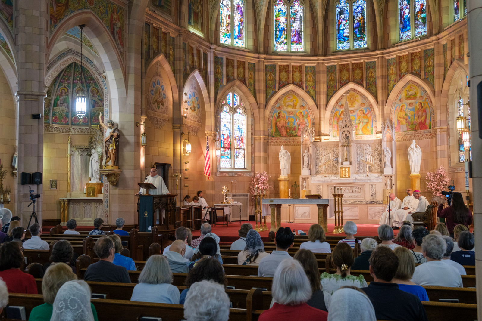 Father Phil Tracy delivers his homily, view from the back of the church.