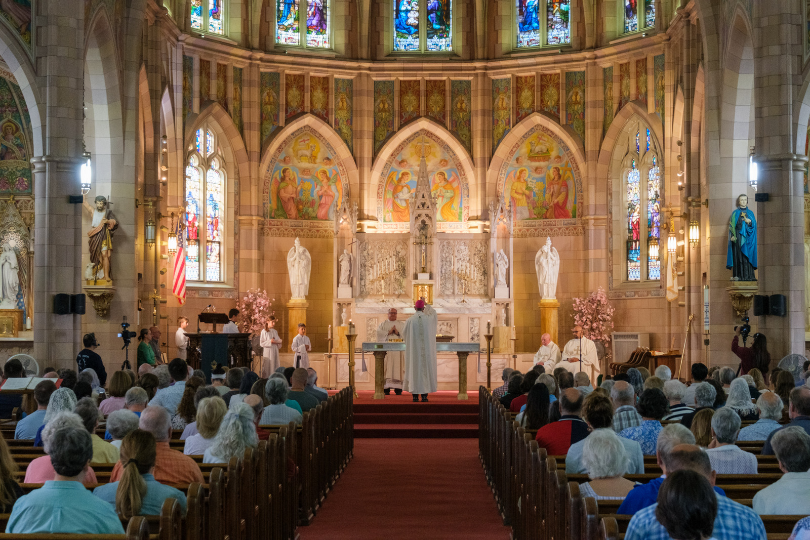 Bishop James Ruggieri incenses the altar, view from the back of the church.