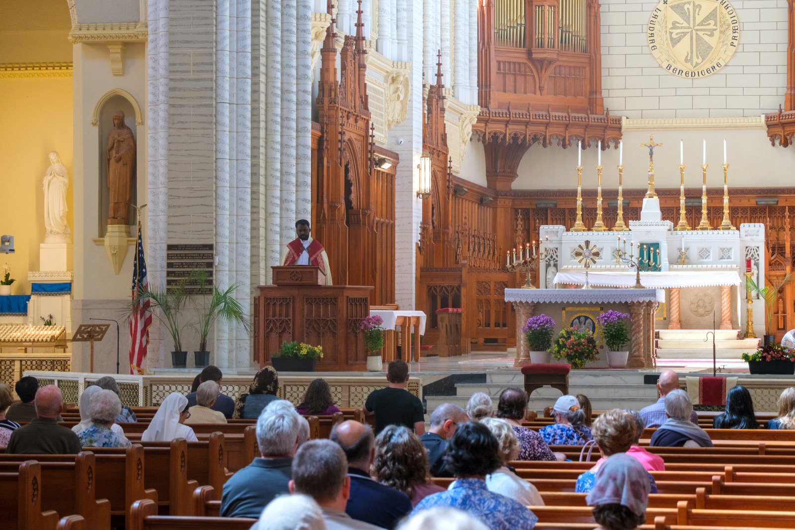 Father Raja gives reflection at the Basilica of Ss. Peter & Paul in Lewiston