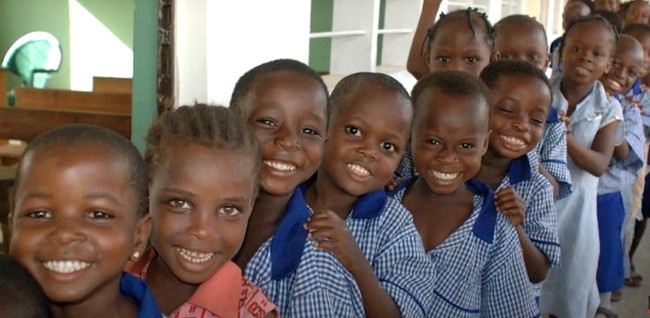 little boys in a row smiling
