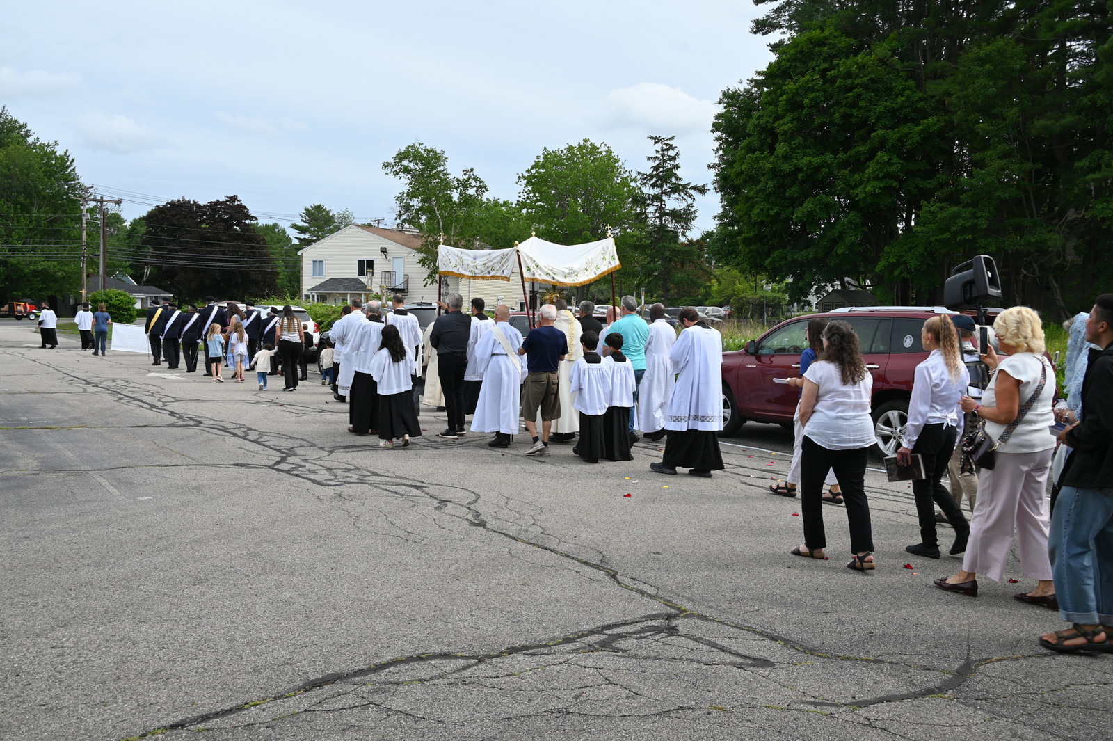 Eucharistic procession around St. Martha Church in Kennebunk, as seen from behind the procession.