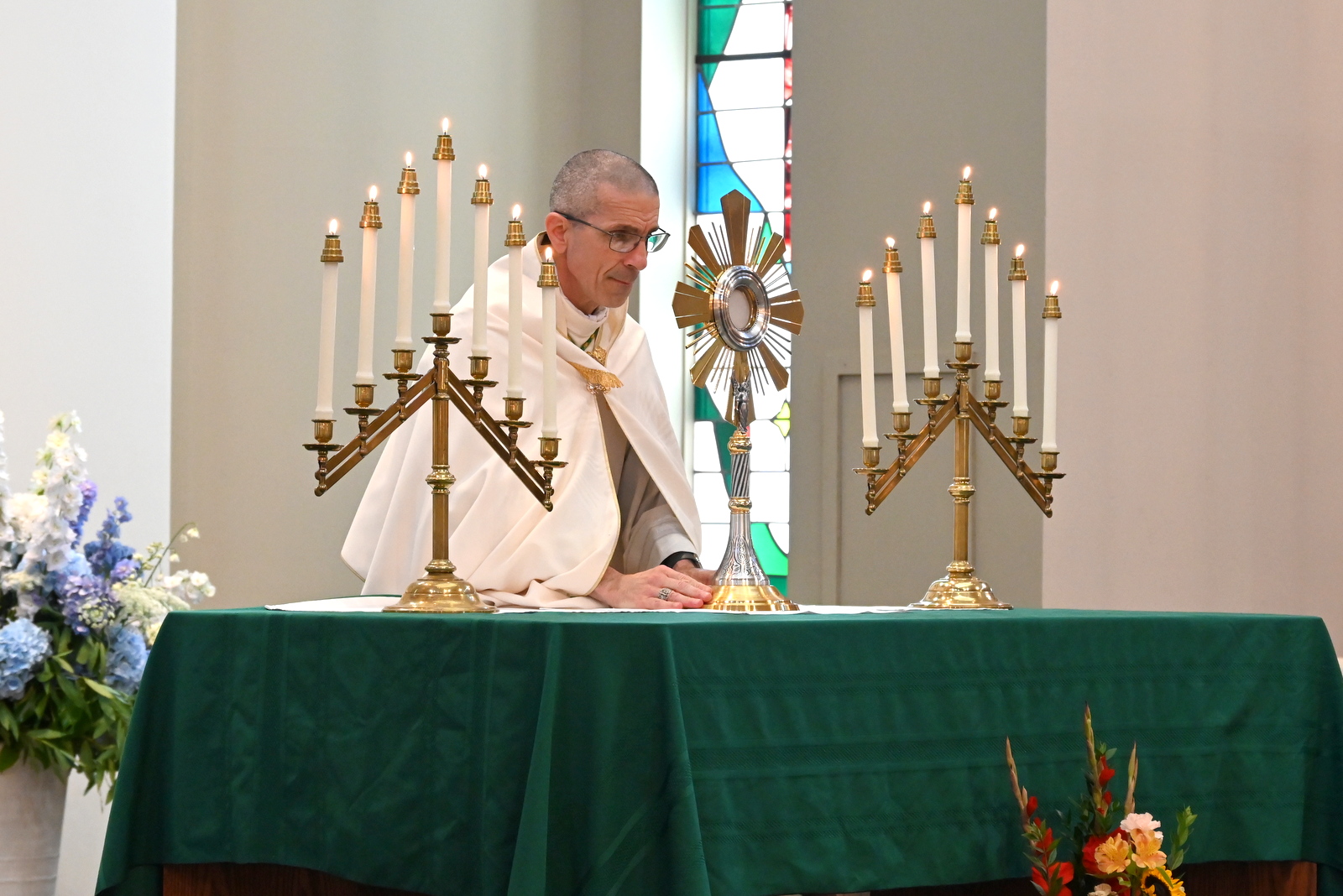 Bishop Ruggieri places the monstrance on the altar.