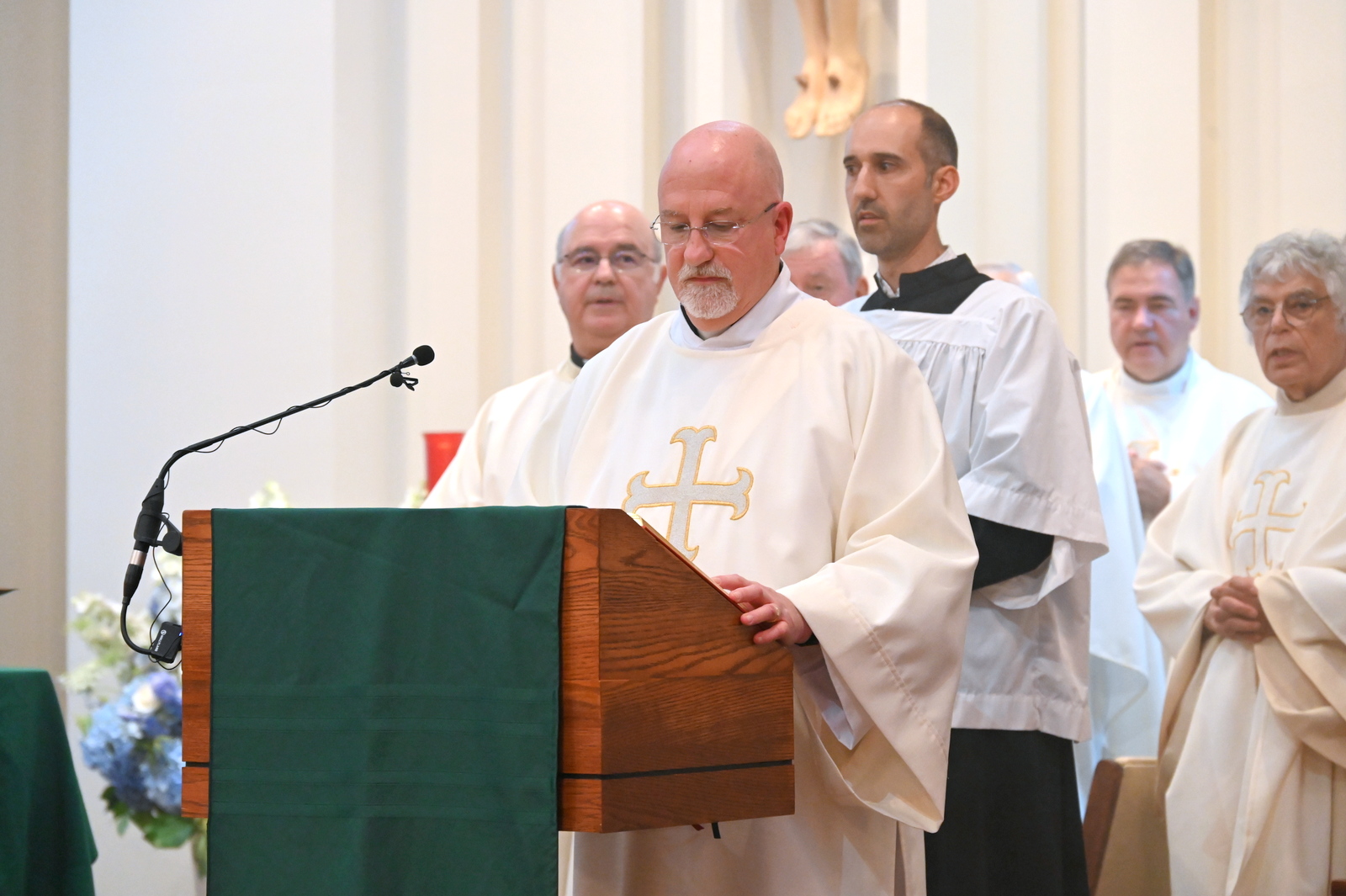 Deacon Richard Huot reads the Gospel.
