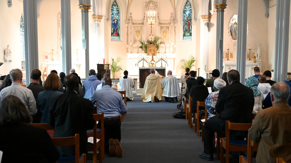 Bishop James Ruggieri incenses the altar; view from the back of the church