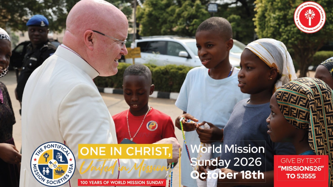 Priest talking with children who are holding Rosary beads