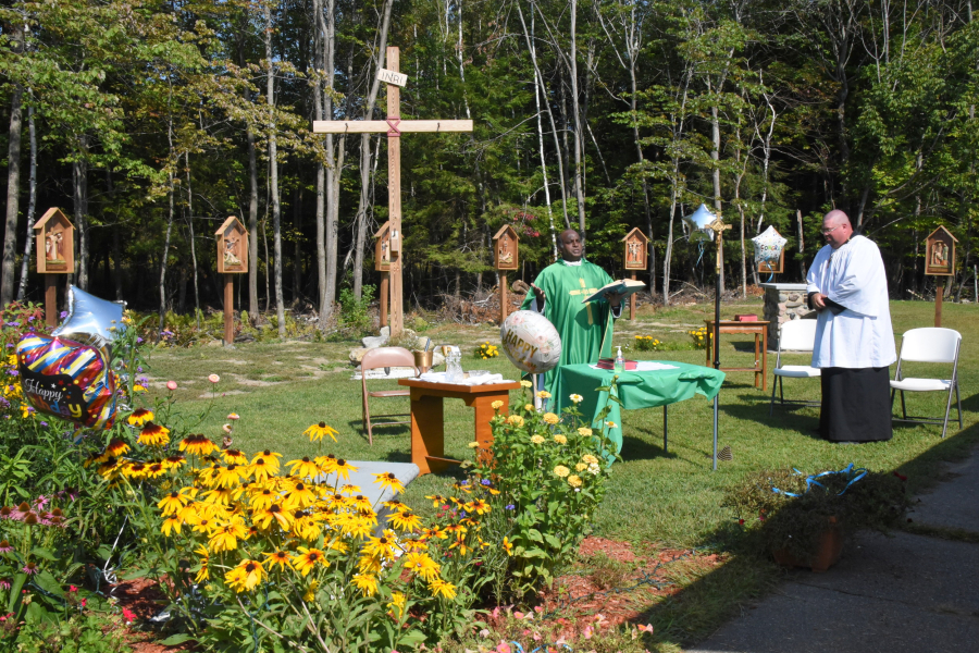 Mass is celebrated outside St. Peter Church in East Millinocket.