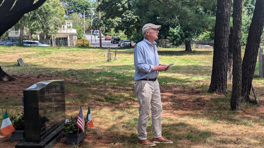 Man speaking in cemetery