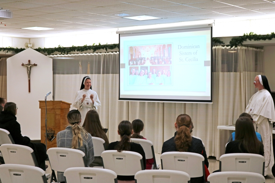 Attendees listen to the Dominican Sisters