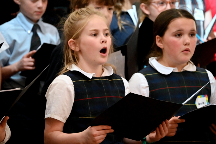 Two girls from St. Brigid School singing
