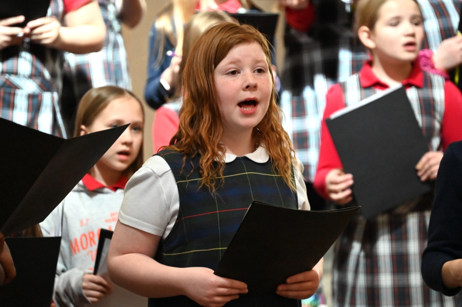 Girl from St. Brigid School singing