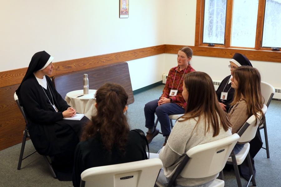 Sisters of Charity talk with young women.