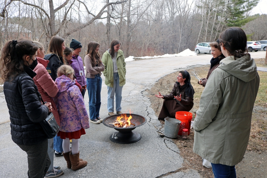 Franciscan Sisters of the Eucharist and attendees make s'mores.