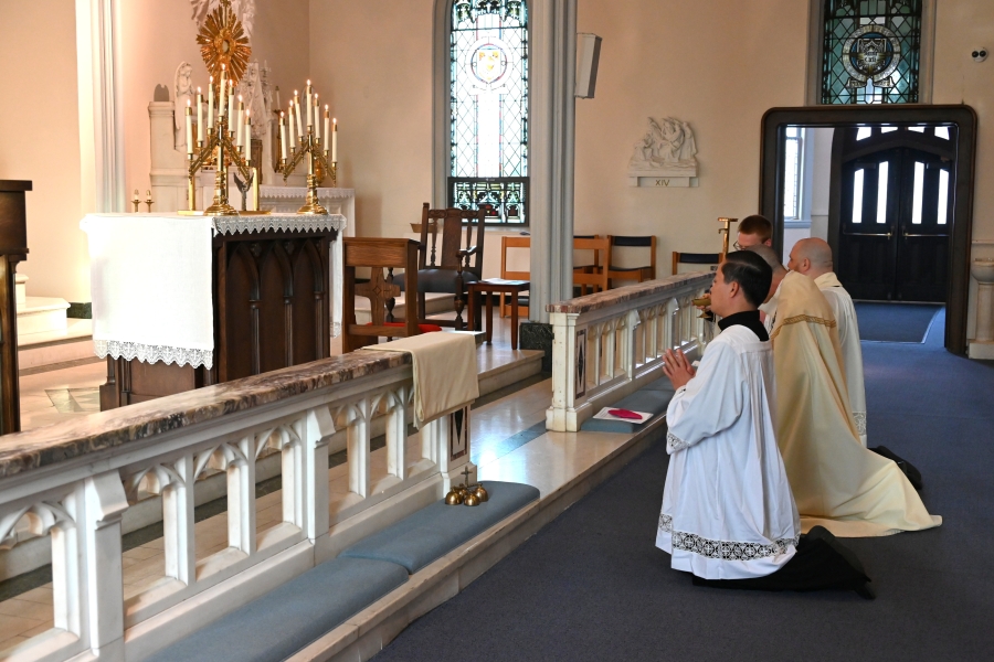 Kneeling before the Blessed Sacrament