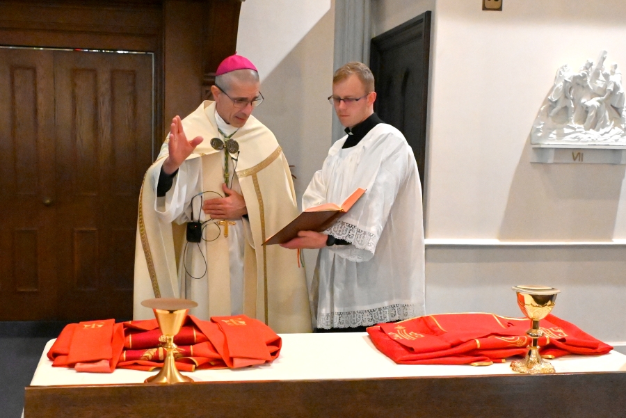 Bishop James Ruggieri blesses the vestments