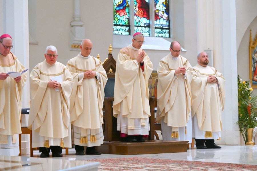 Bishop James Ruggieri, Bishop Robert Deeley, and priests