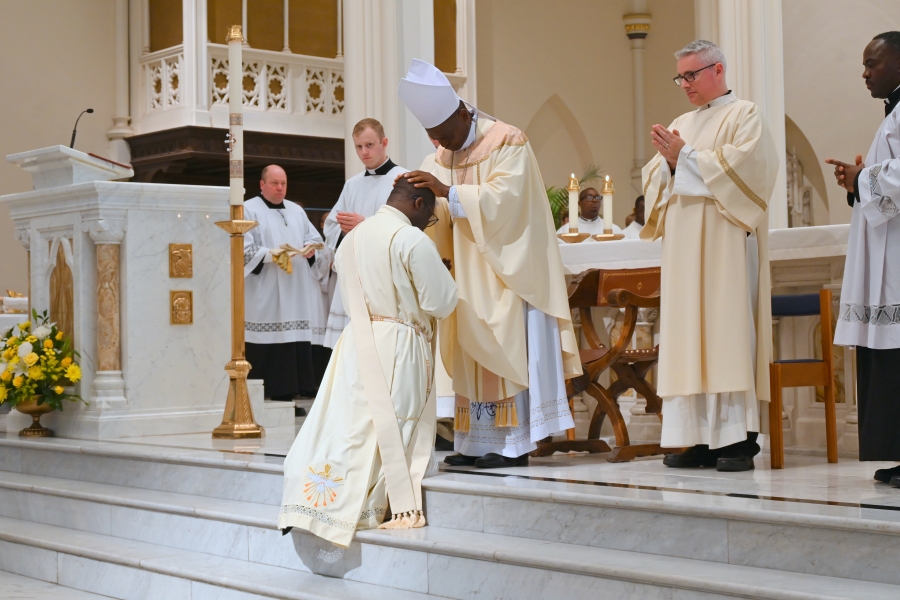 Bishop Nkuo lays hands on Deacon Yongyee