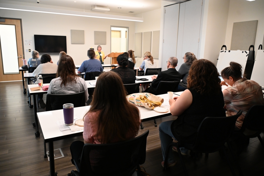 Conference room with participants seated.