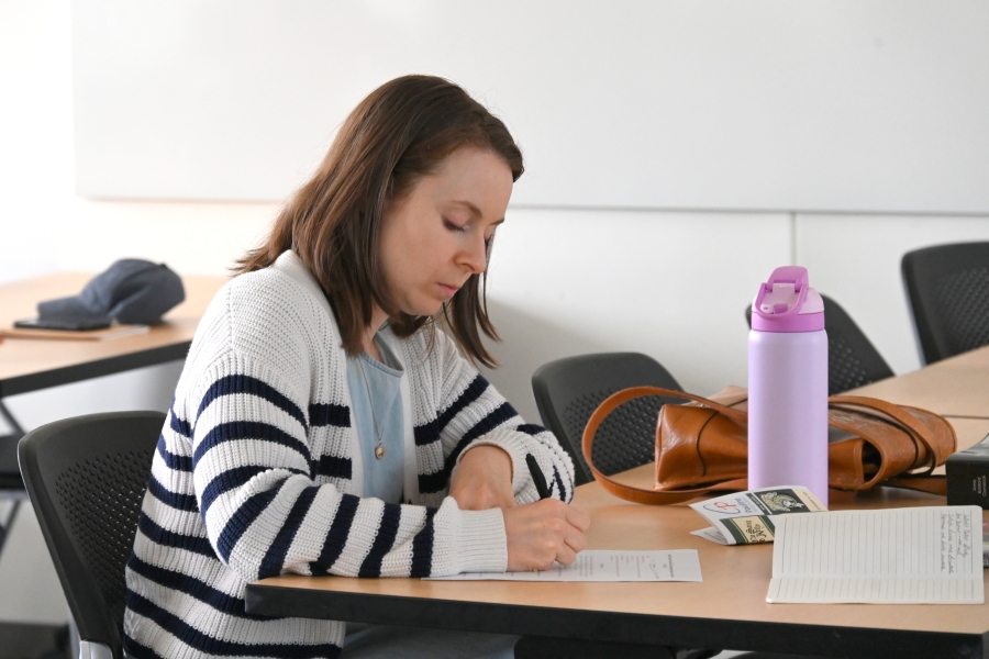 Woman writing.