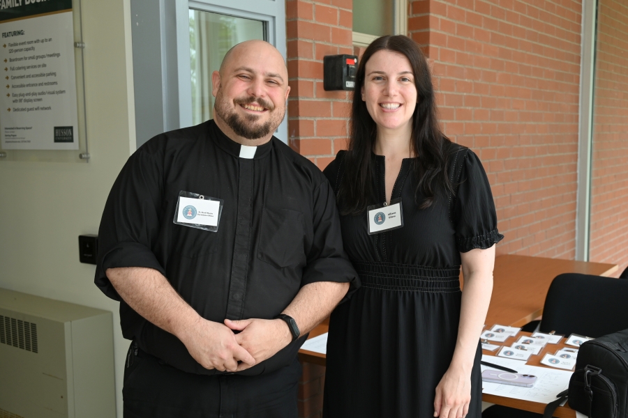 Father Brad Morin and Alison Eilers