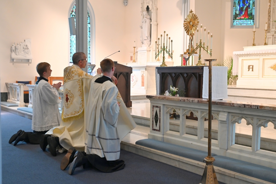 Kneeling before the Blessed Sacrament