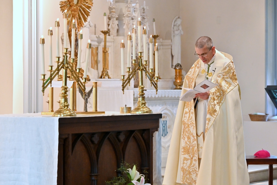 Bishop James Ruggieri praying the Litany of the Sacred Heart.