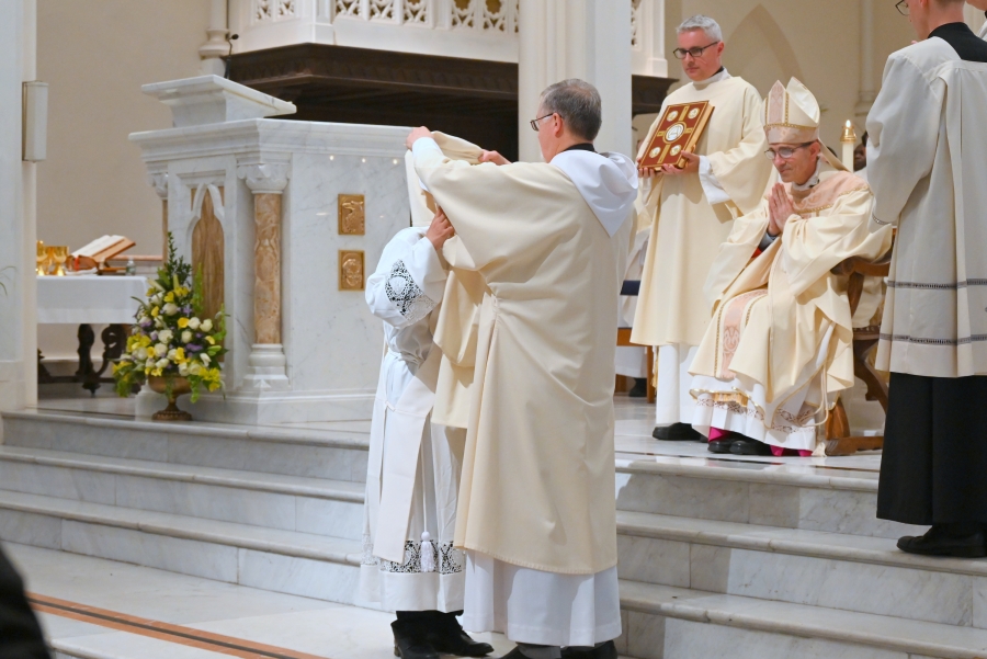 Deacon Peter Bernier vests Deacon Vinh Nguyen.