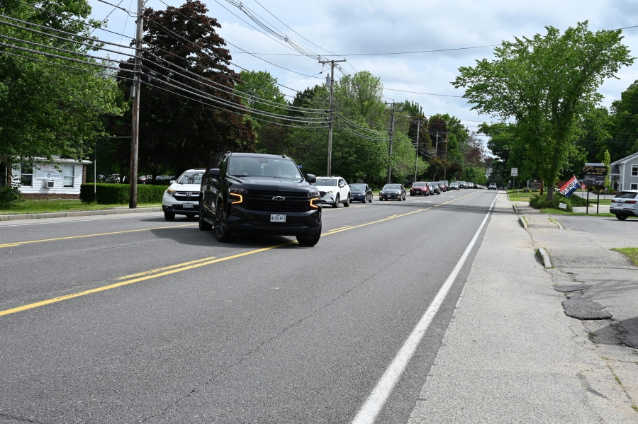 Car procession turns into the parking lot of St. Martha Church in Kennebunk.