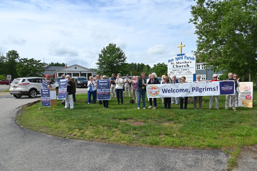 People welcome the procession to St. Martha Church.