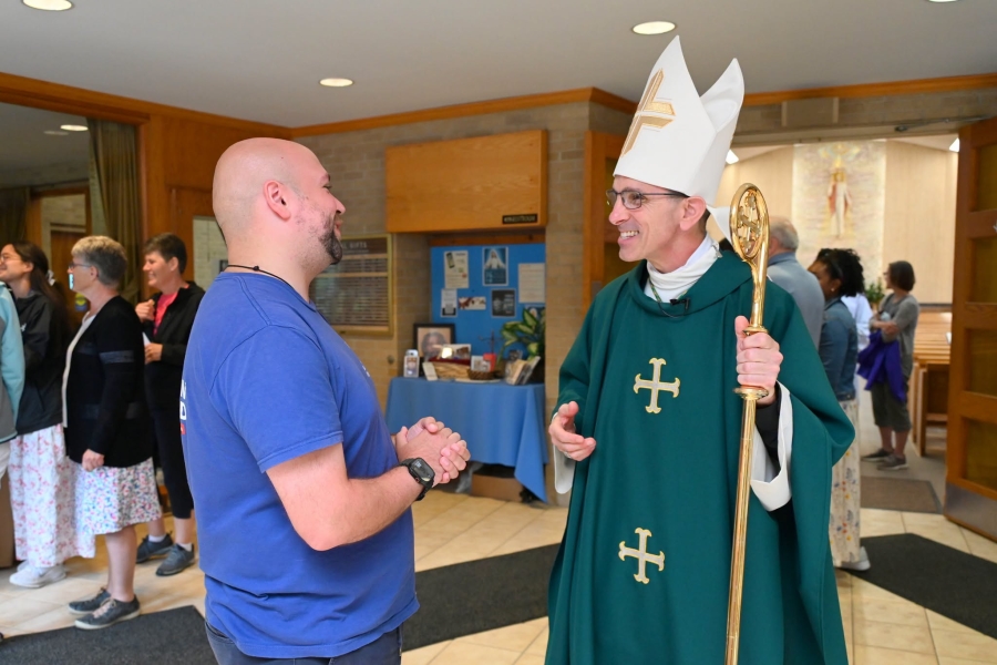 Bishop James Ruggieri chats with one of the pilgrims.
