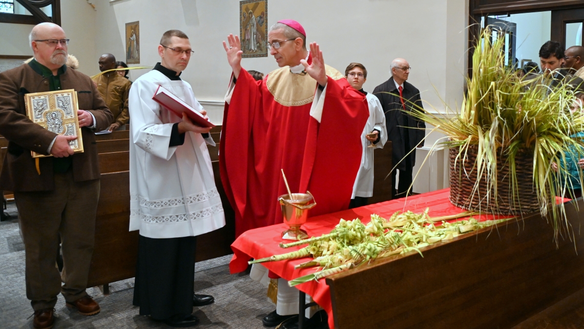 Bishop James Ruggieri blesses palm branches