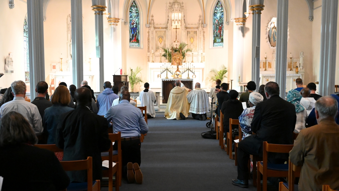 Bishop James Ruggieri incenses the altar; view from the back of the church