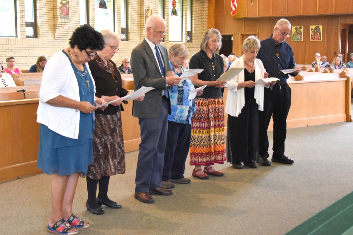 Members of the St. John the Baptist Fraternity renew their promises.