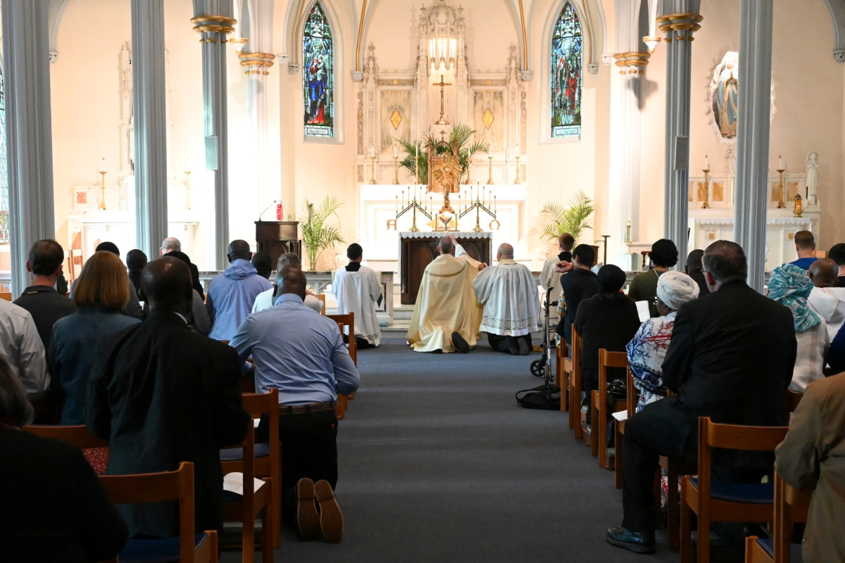 Bishop James Ruggieri incenses the altar; view from the back of the church