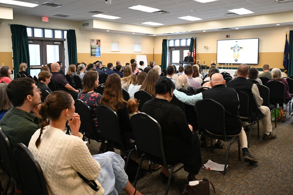 Conference attendees listen to Bishop James Ruggieri.